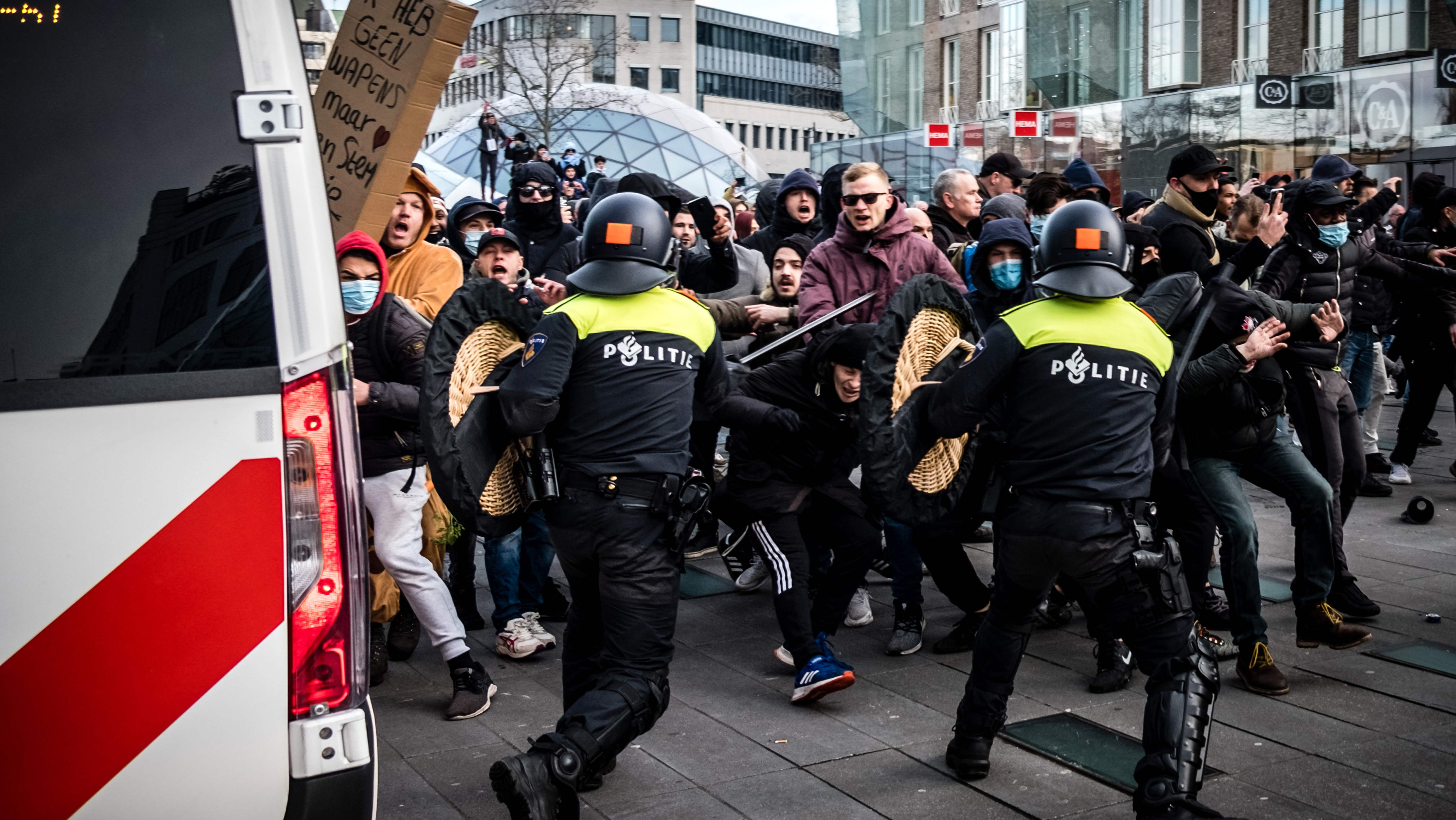 Vehicles burned, shops looted in Dutch curfew protests – latest updates ...